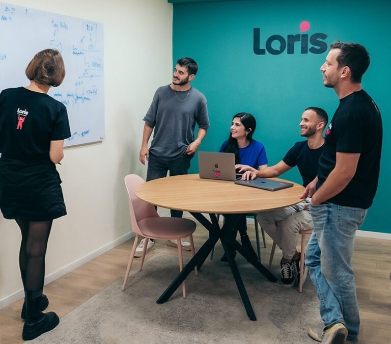 Loris Team looks at Whiteboard